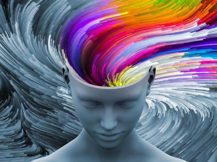 Ilustração conceitual de uma cabeça humana com um fluxo vibrante de cores saindo do cérebro, representando a influência da Psicologia das Cores na mente e nas emoções.